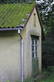 A picture of a metal roof with moss and in need of a roof moss treatment